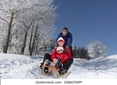 Young Family Sledding On Winter Day Stock Photo 1586674399 | Shutterstock