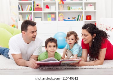 Young Family Story Time With The Kids - Laying On The Floor Together