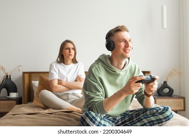 Young Family Suffering From Computer Games Addiction. High Quality Photo