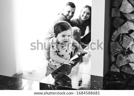 Similar – child girl playing checkers with her dad