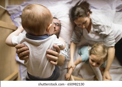 Young Family Together At Home.