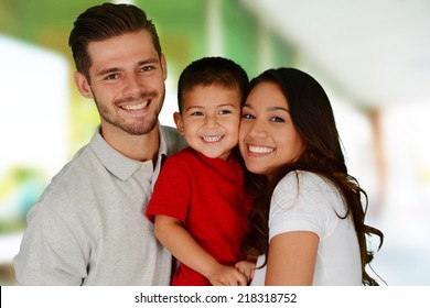 Young Family Together Inside Of Their Home