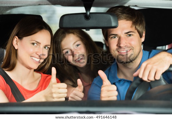 Young Family Travel In
Car