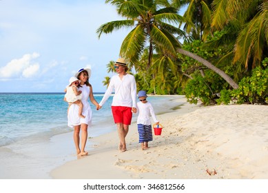 Young Family With Two Kids Walking At Tropical Beach, Family Beach Vacation