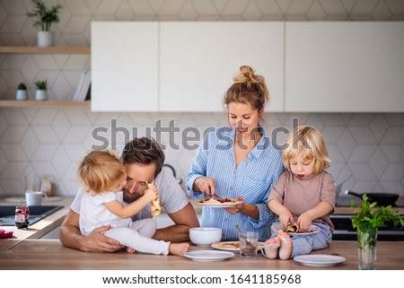 Similar – Mother with eating toddler.