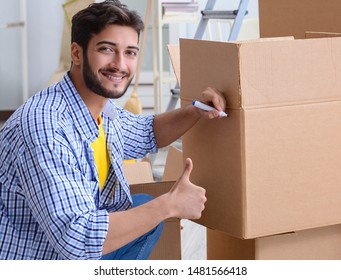Young family unpacking at new house with boxes - Shutterstock ID 1481566418