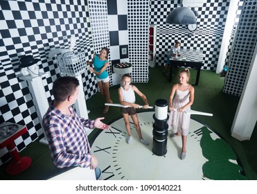 Young Family Is Visiting Of Escape Room Stylized Under Chessboard.