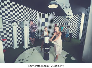 Young Family Is Visiting Of Escape Room Stylized Under Chessboard.