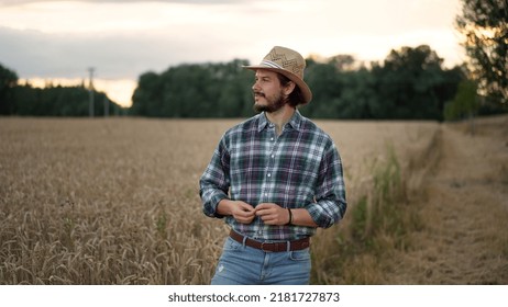 Young Farmer, Business Owner Looks At The Camera In The Field