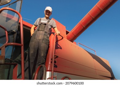 Young Farmer On A Break In Combine After Harvest