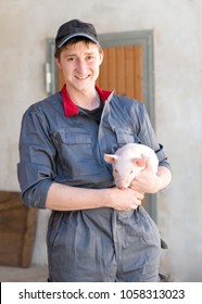 Young Farmer With Young Pig Agriculture 