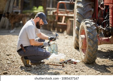 Young Farmer Repairing His Tractor Sunny Stock Photo 1085637167 ...