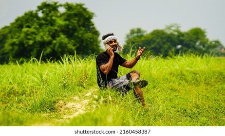 Young Farmer Talking To Someone Indian Image