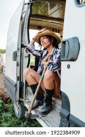 Young Farmer Woman Resting In A Van At Crop Field