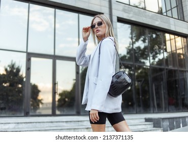 Young Fashion Blonde Woman In Trendy Outfit Posing In The City. Street Fashion