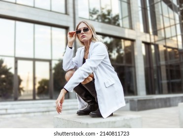 Young Fashion Blonde Woman In Trendy Outfit Posing In The City. Street Fashion