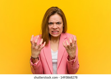 Young Fashion Business Woman Upset Screaming With Tense Hands.