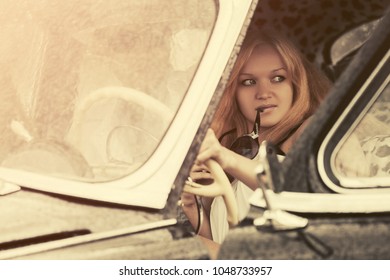 Young Fashion Couple Driving Vintage Car 