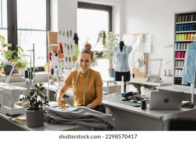 Young fashion designer working at her workplace
 - Powered by Shutterstock