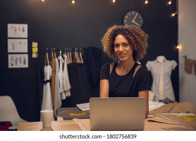 A young fashion designer working on her atelier - Powered by Shutterstock