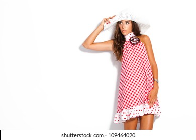 Young Fashion Model In Summer Dress And Hat Studio White