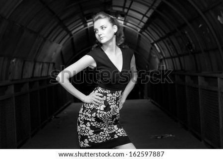 Young fashion woman in modern tunnel.
