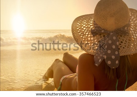 Young fashion woman sunbathing relax on the beach