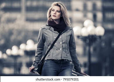 Young Fashion Woman Walking In City Street Stylish Female Model In Plaid Blazer With Shoulder Bag Outdoor