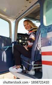 Young Fashionable Woman Pilot Ready To Fly, Start Training, In Small Airplane. Learning Process.