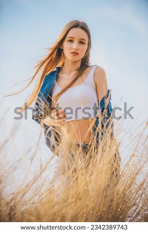 Similar – Young woman doing yoga in nature