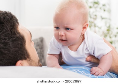 young father cannot soothe his little baby