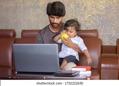 Young Father With His Little Son Working On Laptop At Home - Concept Of Work Form Home Or Wfh Reality, People Lifestyles And Technology.