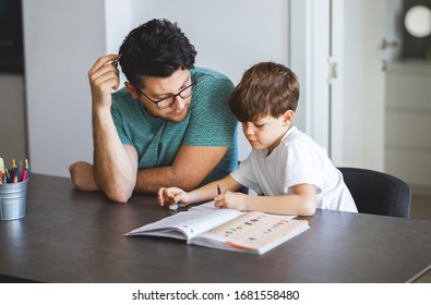 Young Father Homeschooling His Son