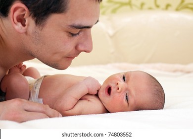 Young Father And Newborn Baby Boy