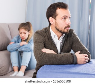 Young father quarrelling with his daughter teenager at home