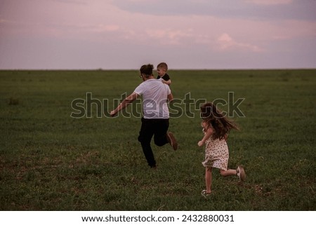 Similar – Family walking Playing