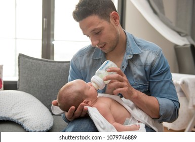 Young Father taking care of his first Baby Boy with love