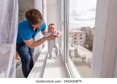 Young father teaches his little cute toddler to walk. - Powered by Shutterstock