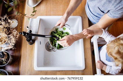 Young father with a toddler boy cooking. - Powered by Shutterstock