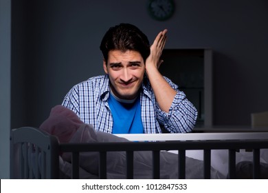 Young Father Under Stress Due To Baby Crying At Night