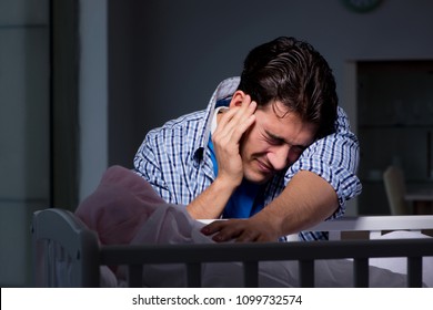 Young Father Under Stress Due To Baby Crying At Night