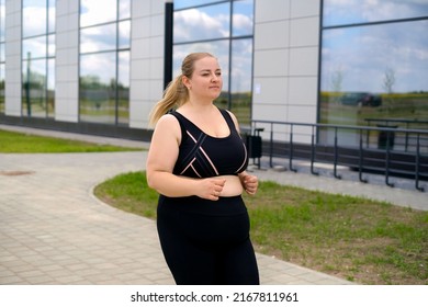 A Young Fatty Overweight Woman In Black Sportswear On A Morning Jog. Daily Running Sessions