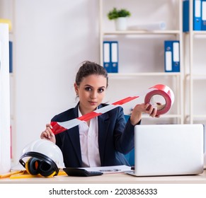 Young Female Architect Working In The Office