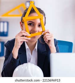 Young Female Architect Working In The Office