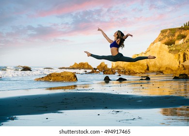 Young female ballet dancer jumping mid air on beach, Los Angeles, California, USA - Powered by Shutterstock