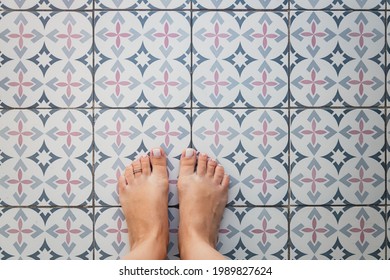 Young Female Bare Feet With A Ring On A Toe On A Light Tile With A Turkish - Moroccan Pattern. View From Above. Copy Space