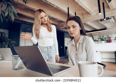 Young Female Boss Scolding Her Female Subordinate For Bad Work Results