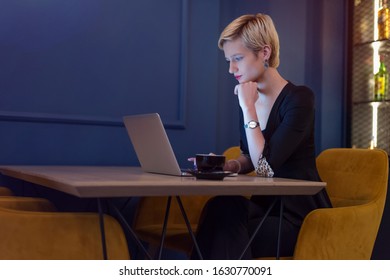 Young female business woman working connected with technological devices at the bar.  Young female creative coworker working with new startup project. - Shutterstock ID 1630770091
