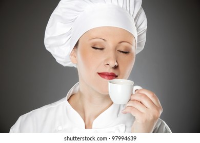 Young female chef enjoying on the coffee break - Powered by Shutterstock