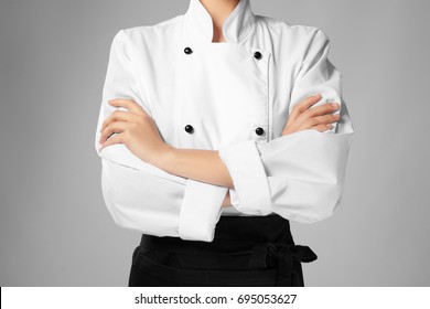 Young Female Chef On Light Background